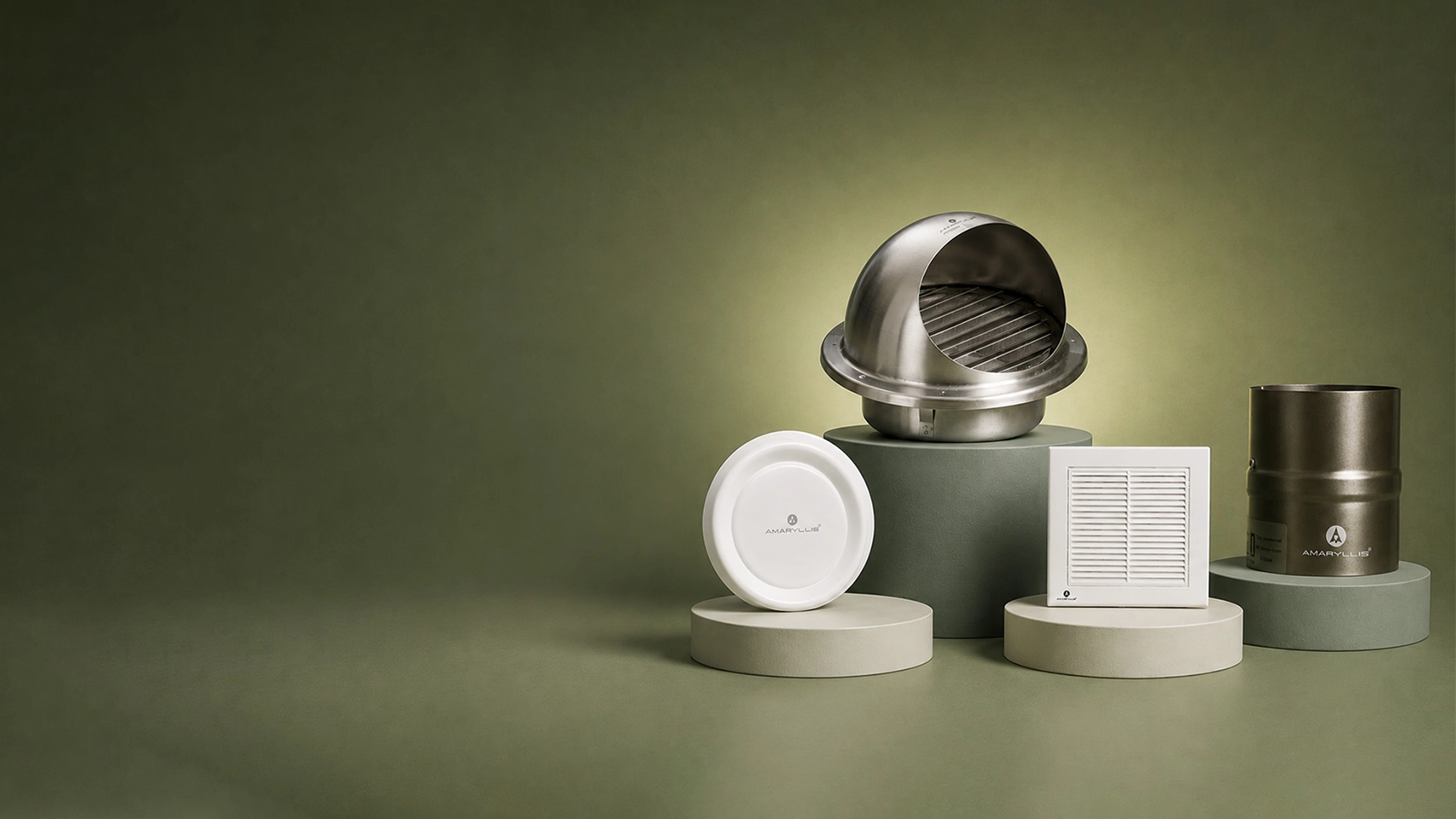 Grilles, diffusers and a cowl arranged on plinths against an olive background
