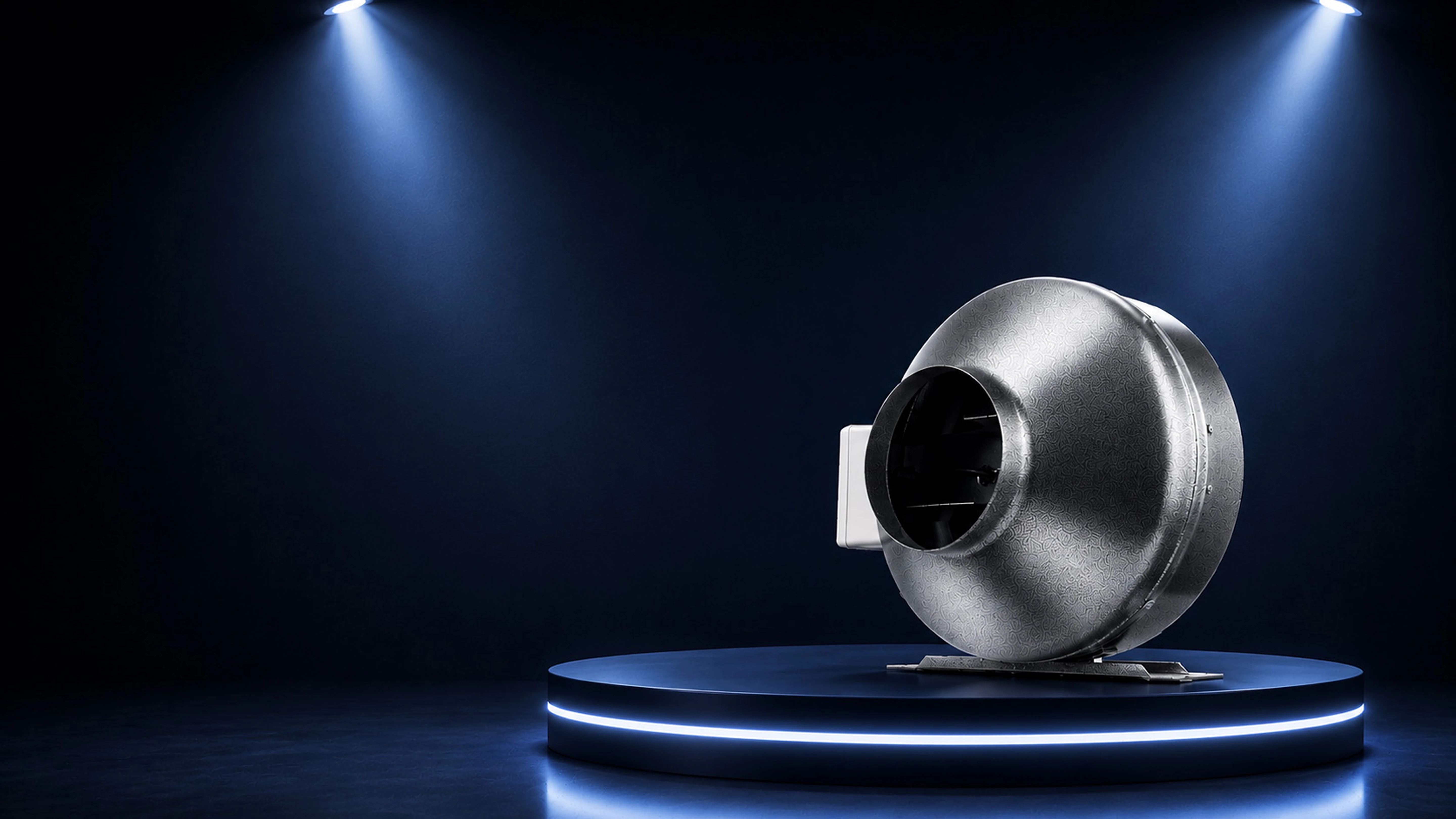 Industrial centrifugal fan lit on a dark plinth